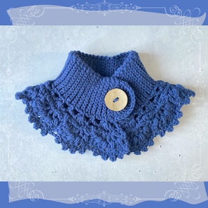 May include: A blue knitted neck warmer with a crocheted edge and a wooden button.