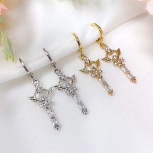 Rhodium or gold plated angel heart wand charm earrings with cubic zirconia cz accents and mini huggie hoops, trendy, y2k