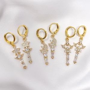 Gold plated angel star, moon, or heart wand charm earrings with cubic zirconia cz accents and gold plated mini huggie hoops