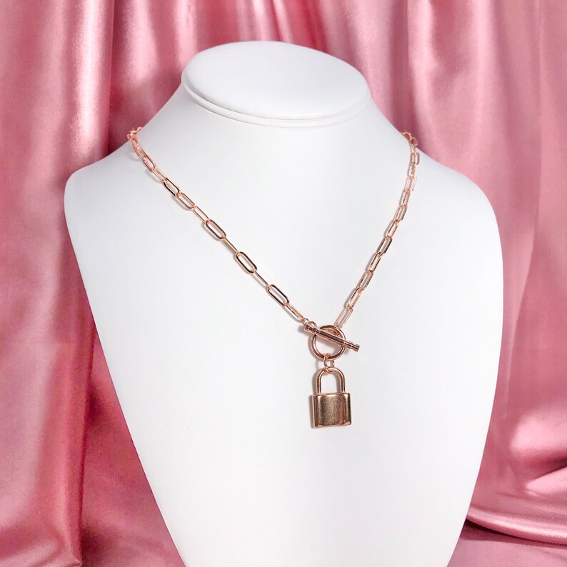 Rose gold plated paper clip chunky oval chain necklace with toggle clasp and rose gold plated stainless steel lock pendant