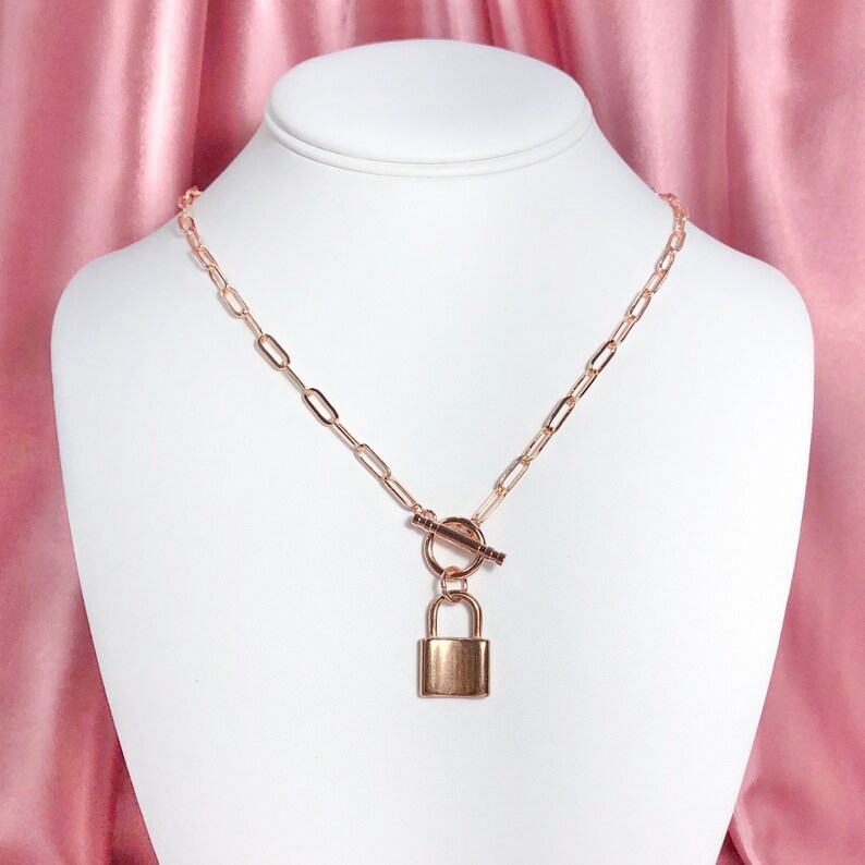 Rose gold plated paper clip chunky oval chain necklace with toggle clasp and rose gold plated stainless steel lock pendant