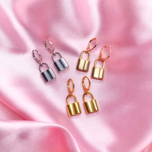 Stainless steel lock charm earrings with rhodium, rose gold, or gold plated mini huggie hoops