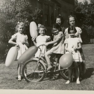 Balloons and a bike, vintage snapshot photo