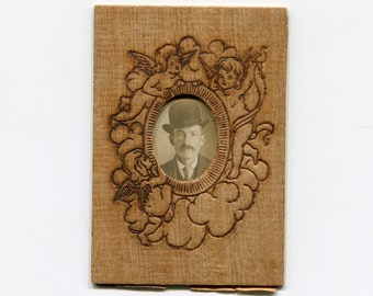 Homemade pyrography frame, antique photo booth photo