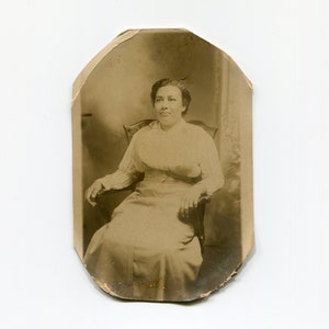 Cut to fit an oval, antique African American rppc photo