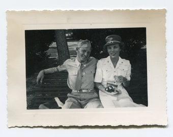 Man and woman in uniform, vintage snapshot photo
