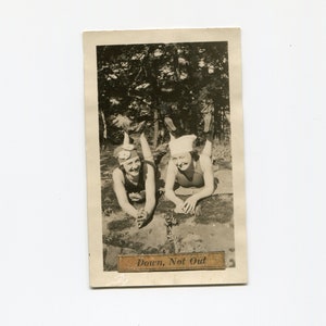 Down, not out, vintage snapshot photo