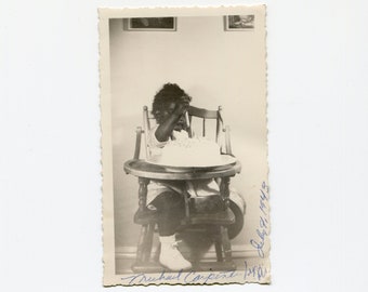 Cutting his own cake, vintage African American snapshot photo