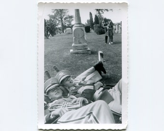 Lounging in a cemetery, vintage snapshot photo