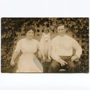 Family of three, antique rppc photo