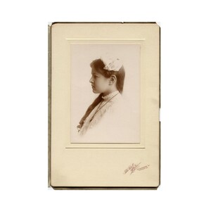 Profile, antique cabinet card photo in folder