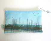 Pouch realized from a embroidered seaside photo with a bird