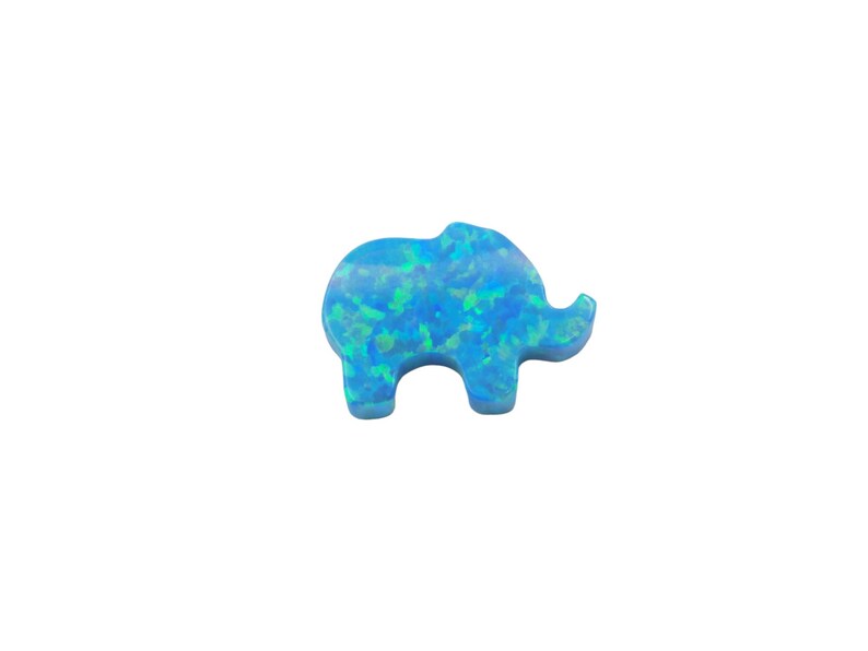 May include: A blue opal elephant charm with a light blue and green iridescent finish.