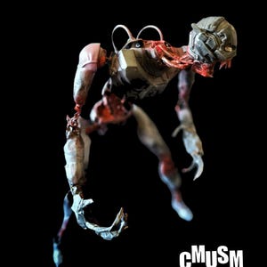 May include: A detailed, artistic rendering of a humanoid figure with a mechanical head and exposed internal structures. The figure is primarily gray and white, with red accents, set against a black background. The letters "cMuSm" are in white.