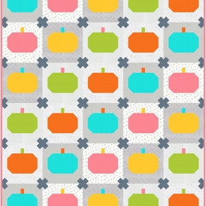 May include: A quilt pattern featuring a grid of 36 colourful pumpkin shapes. The pumpkins are in shades of pink, yellow, green, orange, and blue. The background is a light grey with a subtle texture.