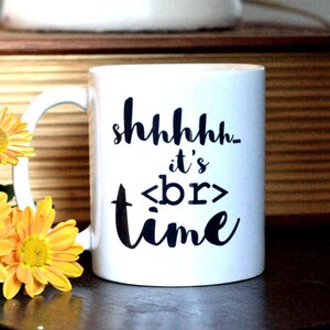 May include: White ceramic mug with a black design that says "shhhhh... it's <br> time".