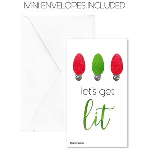 May include: A white card with three Christmas lights, one green and two red, and the text "Let's get lit".