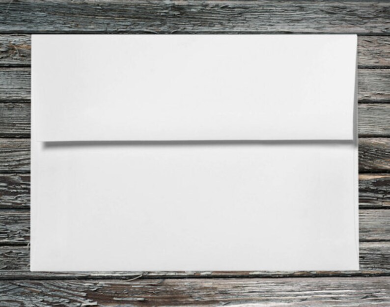 May include: A white envelope on a weathered wooden background.