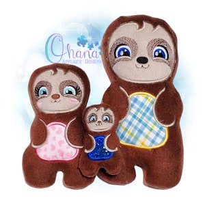May include: Three plush sloth toys in different sizes. The largest sloth is brown with a blue and yellow plaid fabric on its belly. The middle sloth is brown with a pink and white polka dot fabric on its belly. The smallest sloth is brown with a blue and white starry fabric on its belly. All three sloths have embroidered faces with blue eyes.