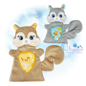May include: Two plush squirrel hand puppets. One is brown with a yellow patch, the other is gray with a blue patch. Both have embroidered details, including blue eyes and a white nose. The patches feature a squirrel and autumn leaves.