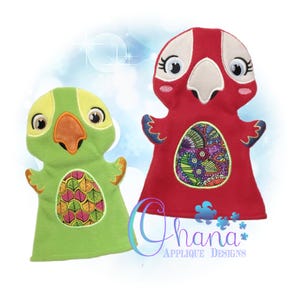 May include: Two felt hand puppets, one green and one red, shaped like parrots with large eyes and beaks. Both puppets have a colorful patterned design on their bellies.