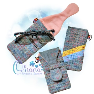 May include: Three quilted eyeglass cases in different designs. The cases are gray with colorful stitching and a flap closure. One case has a yellow and blue stripe, another has a flap with a button, and the third has a pink lining.