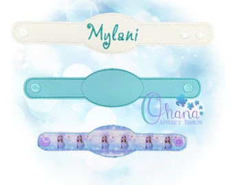 May include: Three wristbands in the image. The top one is white with the name "Mylani" in teal glitter. The middle one is light blue. The bottom one has a pattern of a princess and snowflakes.