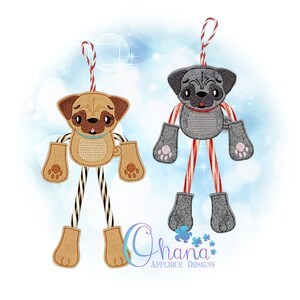 May include: Two embroidered pug ornaments with candy cane legs. The pugs are brown and gray with pink noses and black eyes. The candy canes are red and white.