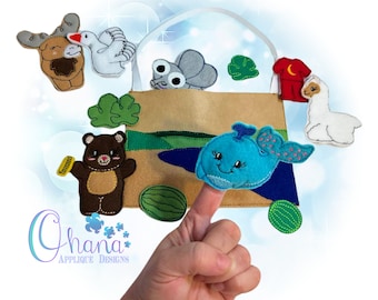 May include: A felt finger puppet set with a brown bear, a blue whale, a white goose, a gray fly, a brown moose, a white llama, and a red shirt. The puppets are arranged around a brown felt bag with a white handle.