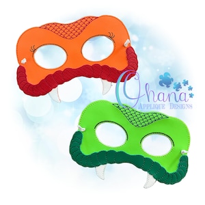May include: Two felt dragon masks, one orange with red details and one green with green details. Both masks have white teeth and eye holes.