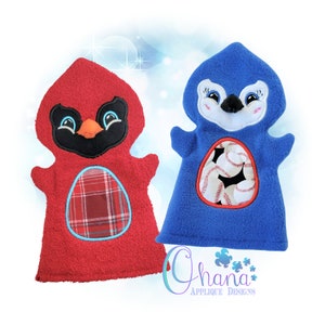 May include: Two plush hand puppets, one red cardinal and one blue penguin. The cardinal has a plaid fabric patch on its chest. The penguin has a clear window on its chest with baseballs inside. The puppets are made by Ohana Applique Designs.