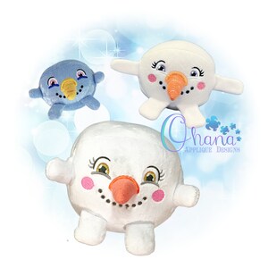 May include: Three plush snowman toys, one blue and two white. The white snowmen have embroidered faces with pink cheeks, black eyes, and orange noses. The blue snowman has a yellow beak and pink cheeks.