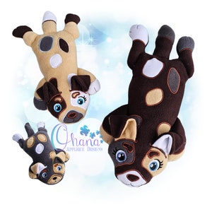 May include: Three plush dog toys in different sizes. The largest dog is brown with tan and white spots. The medium dog is tan with brown and white spots. The smallest dog is gray with tan and white spots. All three dogs have black eyes and white noses.