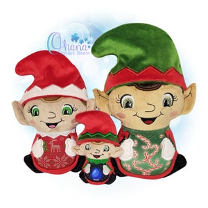 May include: Three plush elf ornaments with embroidered faces and festive clothing. The largest elf is wearing a green hat and a red and green candy cane patterned shirt. The middle elf is wearing a red hat and a red and white reindeer patterned shirt. The smallest elf is wearing a green hat and a red and green candy cane patterned shirt.