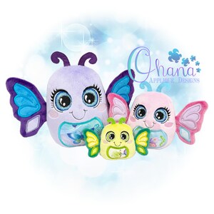 May include: Three plush butterfly toys in varying sizes. The largest is lavender with blue and purple wings, the medium is pink with pink and purple wings, and the smallest is yellow with green wings. Each has large eyes and a smiling face.