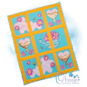 May include: A yellow and blue quilt with a honeycomb, heart, and watering can design. The quilt is made up of nine squares, each with a different design. The designs are embroidered with gold, pink, and white thread. The quilt is perfect for a baby's nursery or a child's bedroom.