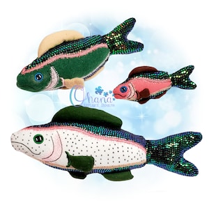 May include: Three plush fish toys with embroidered details. The largest fish is green and has a light brown fin. The medium fish is white with black spots and a green fin. The smallest fish is pink with a brown fin. All three fish have iridescent green scales.