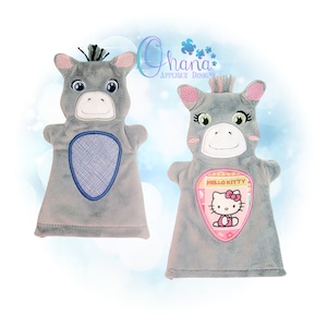 May include: Two gray plush donkey hand puppets. One puppet has a blue embroidered patch on the chest. The other puppet has a pink Hello Kitty patch on the chest.