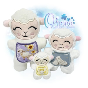 May include: Three plush white lamb toys with embroidered faces and different colored accents. The largest lamb has a purple and yellow floral design on its chest, the middle lamb has a blue and white design, and the smallest lamb has a yellow and white design.