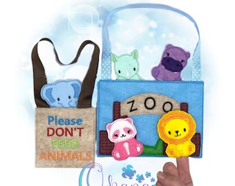 May include: A felt finger puppet set with a blue, brown, and beige zoo theme. The set includes a rhino, hippo, panda, lion, and elephant. The sign says "Zoo". The set also includes a brown felt bag with a sign that says "Please Don't Feed Animals".