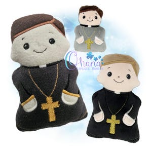 May include: Three plush priest dolls in black, gray, and white robes, each with a gold cross necklace. The dolls have smiling faces and brown or light brown hair. The Ohana Applique Designs logo is visible in the background.