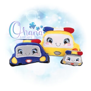 May include: Three plush toy cars in blue, yellow, and grey, each with smiling faces, eyelashes, and red and blue lights. The text "Ohana Applique Designs" is in the upper left corner.