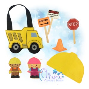 May include: A set of felt construction worker themed toys, including a yellow dump truck, a construction worker hat, a traffic cone, a stop sign, a detour sign, and two construction worker figures, one wearing a yellow hard hat and the other wearing a pink hard hat.