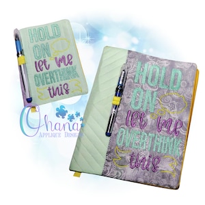 May include: Two green and grey fabric notebook covers with a pen holder and the text "Hold on let me overthink this" embroidered on them.