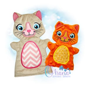 May include: Two plush cat hand puppets. The first puppet is beige with pink and white chevron detailing. The second puppet is orange with yellow and white floral detailing.