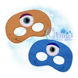 May include: Two felt eye masks with a single large eye on each. One mask is brown and the other is blue. Both masks have a smiling mouth.
