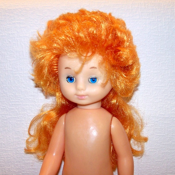 old doll with red hair