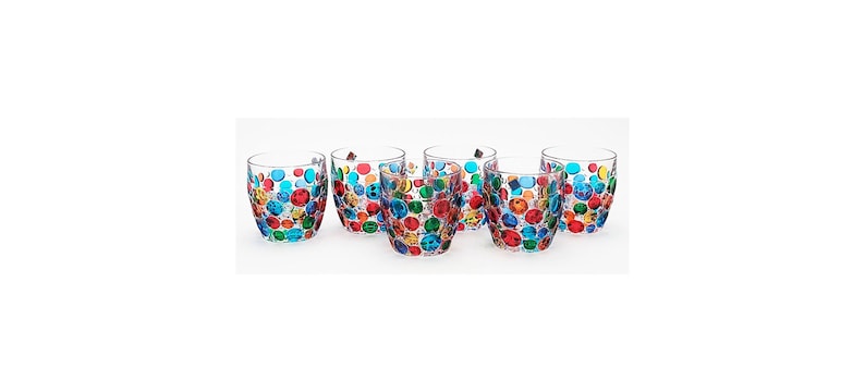 May include: Set of six clear glass tumblers with a colorful polka dot pattern. The dots are in shades of red, blue, green, and yellow.