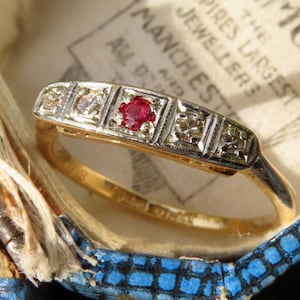 May include: A rustic wooden sign with the text "Welcome to our home" in white lettering. The sign has a distressed finish and a simple, inviting design, suitable for a front porch or entryway.