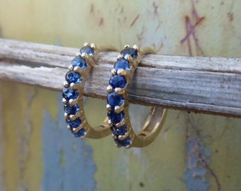 Solid gold hoop earrings with sapphires